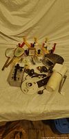 Overview of assorted hardware, Geiger counter, hooks, knobs and accessories