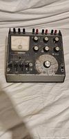 Front view of Heathkit transistor tester showing meter, knobs, jacks