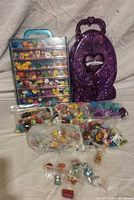 Full lot with both display cases, bags of figures and accessories visible