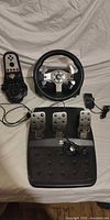 Overview of wheel, pedal board, shifter, power adapter and cables