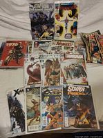 Group shot of assorted comics laid out, various titles visible