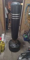 Front view of freestanding punching bag showing full height and fillable base