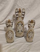 Front view of all three angel figurines