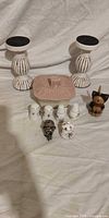 Lot overview showing candlesticks, candy dish, shakers, cat figurine, beaded ring