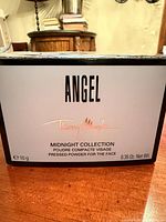 Front of box displaying Angel branding, collection name, weight 10 g / 0.35 oz
