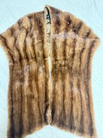 Full view of mink fur stole laid flat showing outer fur surface