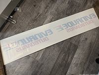 Full decal laid flat showing Evinrude Outboards text