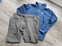 Jacket and pants laid out front view