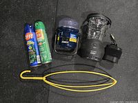 All items grouped: two lanterns, two OFF! cans, Thermacell device, yellow hanger