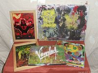 Group shot showing all five paintings together