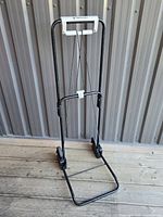 Cart fully extended showing frame, handle, wheels and base platform