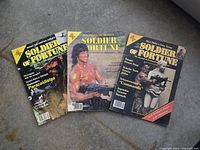 Front covers of three Soldier of Fortune magazines