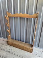 Full front view of wooden wall mount rack