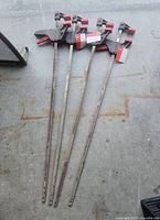 Four 36 in. Jobmate bar clamps laid out