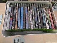 Tray of original Xbox game cases showing spines