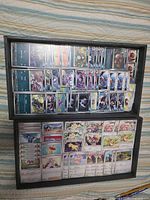 Overview of two trays filled with Pokémon cards