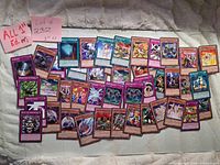 Full layout of roughly 40 Yu-Gi-Oh! cards displayed on wall