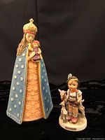Front view of both Hummel figurines together