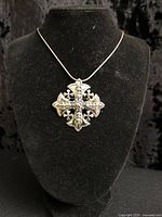 Front view of Jerusalem cross pendant on display bust