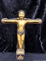 Front view of carved and painted wooden crucifix figure