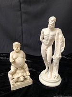 Front view of both statues together showing relative sizes