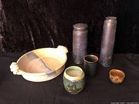Entire group: casserole dish, two tall vases, three small vessels