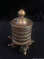 Prayer wheel front view showing drum and base