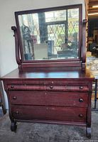 Front view showing dresser and mirror, drawer arrangement, overall design