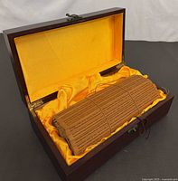 Scroll rolled inside lined wood box