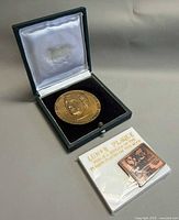 Medal in presentation case with Apollo 11 plaque in sleeve