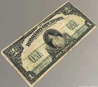 Obverse of 1917 Dominion of Canada $1 bill showing portrait, serial number, signatures and wear