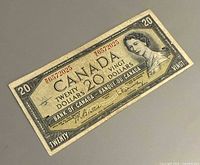 Front view of the 1954 $20 bill showing serial number, denomination, signatures, and portrait