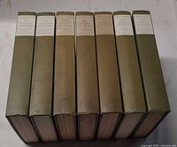 Seven volumes showing spine labels and cloth colour