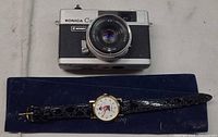 Konica C35 camera and Ed Mirvish watch overall view