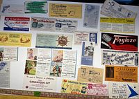 Group shot of entire assortment of advertising ink blotters laid out on table