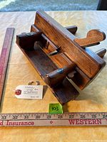 Top view showing plane body, iron, wedge and maker tag