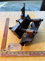 Full view of wooden plow plane with ruler for scale