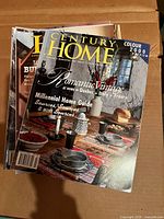 Front covers of several Century Home magazines, top issue dated Colour 2000 Preview