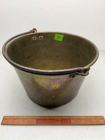 Overall view of brass jelly pail, iron bail, visible patina and crack indicator