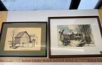 Both framed prints side by side on table