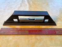 Side view of Stanley No.36 level beside ruler for scale