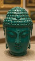 Front view Buddha head showing facial features and color