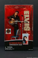 Front view of sealed box showing figure, accessories and branding