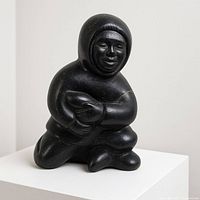 Full view of black soapstone sculpture on pedestal