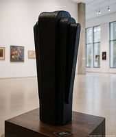 Full view of sculpture on pedestal, shows overall form and finish