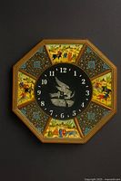 front view of octagonal wall clock on dark wall