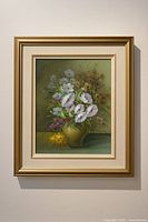 Full frontal view of framed floral still life painting