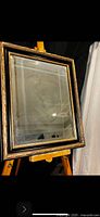 Full view of mirror on easel showing frame and beveled glass