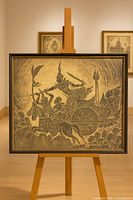 Full view of framed paper relief rubbing on easel