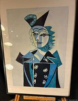 Full view of framed Picasso reproduction print on easel